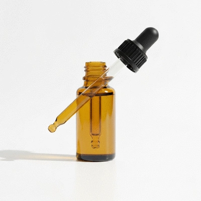 Organic CBD oil tincture with a dropper, on a clean background